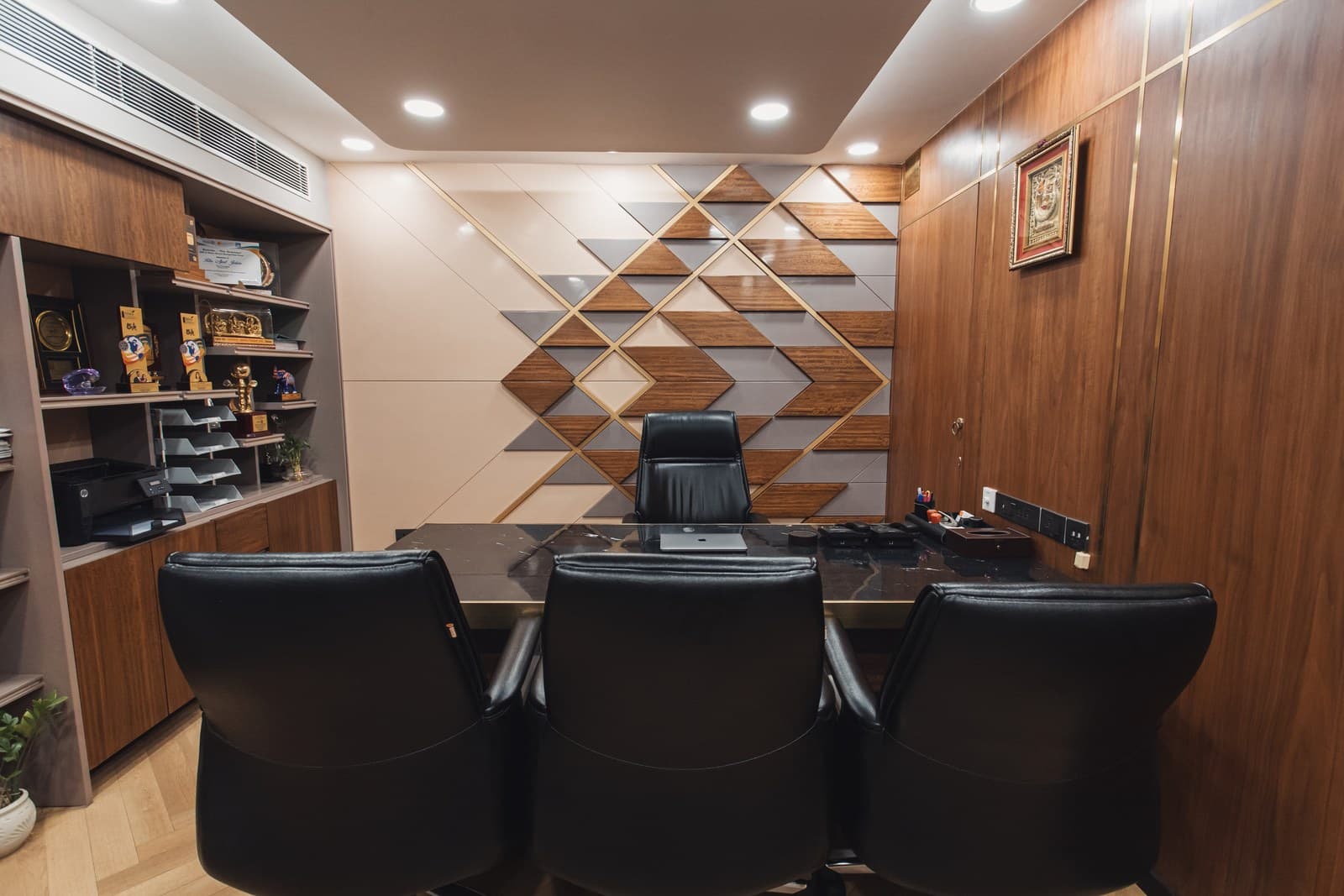 Boardroom with a polished conference table and leather chairs
